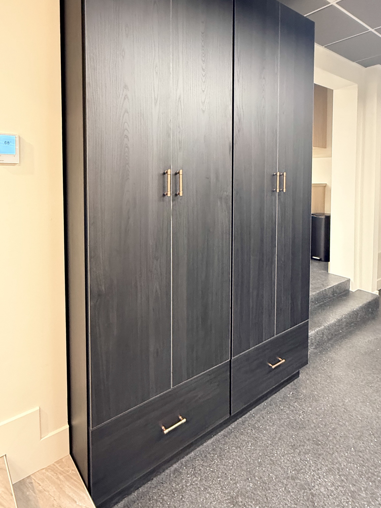 Commercial cabinetry with light wood drawers and brushed metal hardware